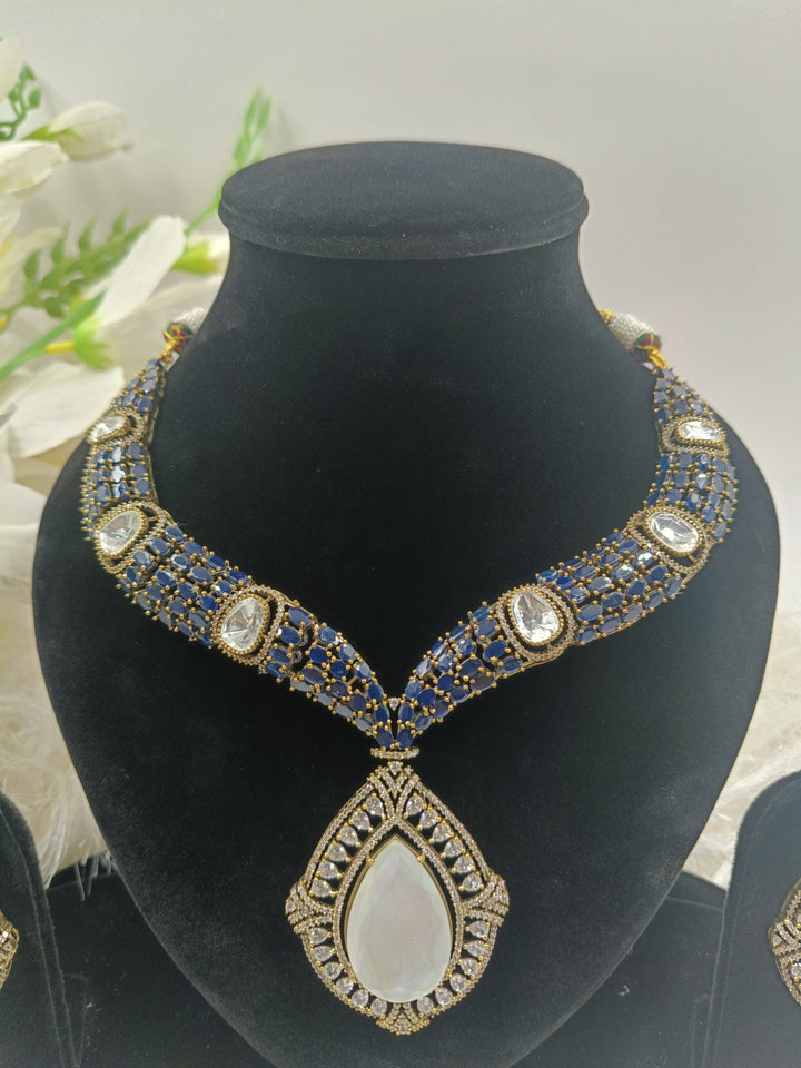 Elegant pink gemstone necklace with gold accents, featuring a delicate pendant design that exudes sophistication and charm.