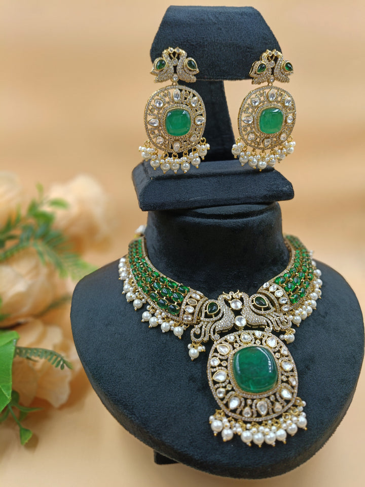 An opulent emerald and pearl necklace featuring two intricately set peacocks, radiating elegance and regal charm.