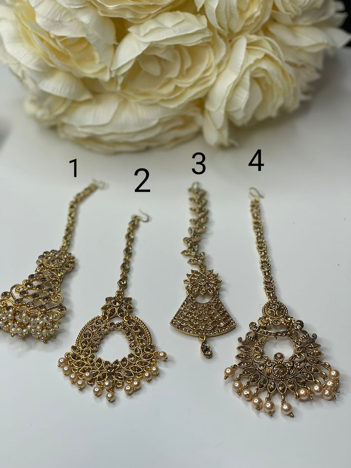 Izhaar Maang tikka in polki stones and pearl accents, Indian head jewelry, Wedding tikka