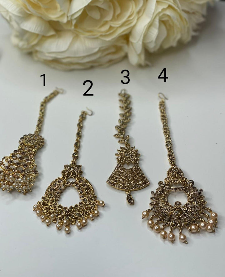 Izhaar Maang tikka in polki stones and pearl accents, Indian head jewelry, Wedding tikka